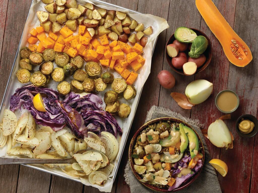 Sheet pan full of vegetables to make plant-based bowls.